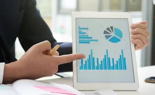 Advisor presenting business charts on a tablet